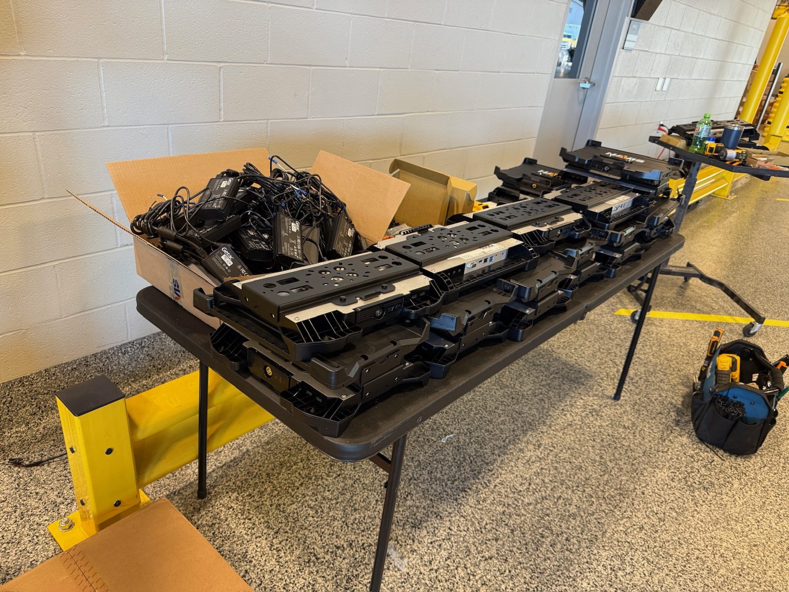 Havis docking stations staged on a table for a fleet rollout.